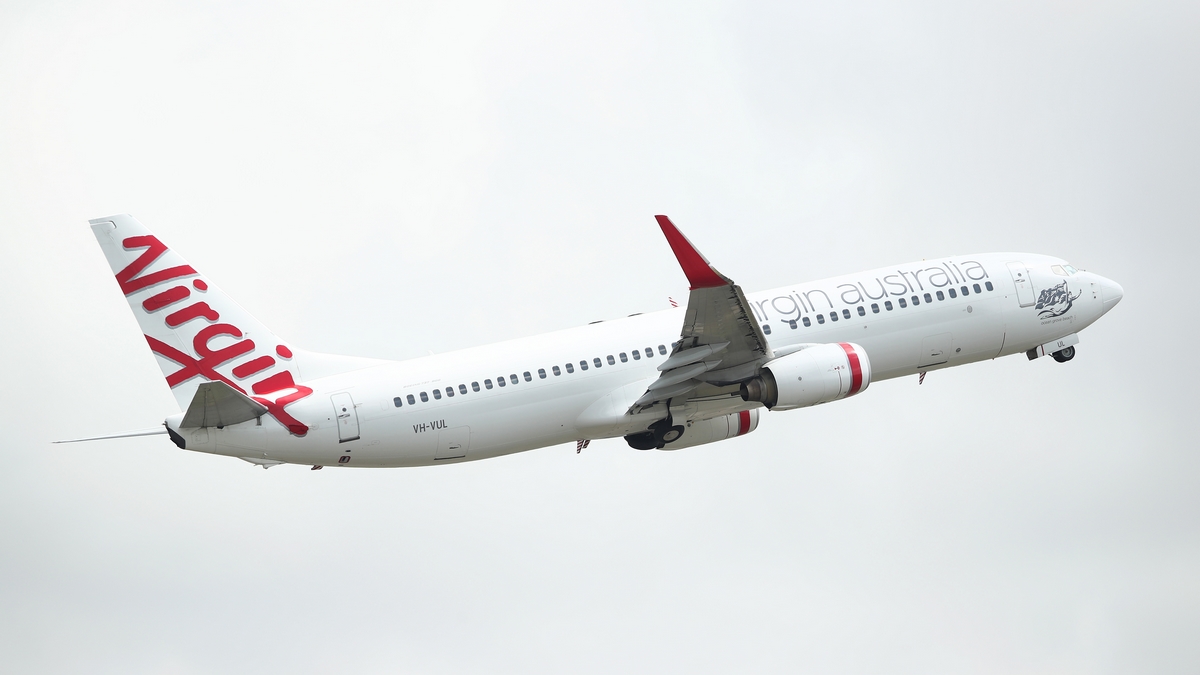 A Virgin Australia commercial plane takes off at Sydney Airport