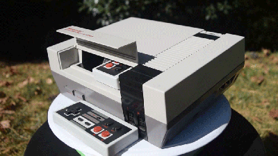 Someone Stuffed An Original NES With A Smaller NES And Its Own Built-in Projector