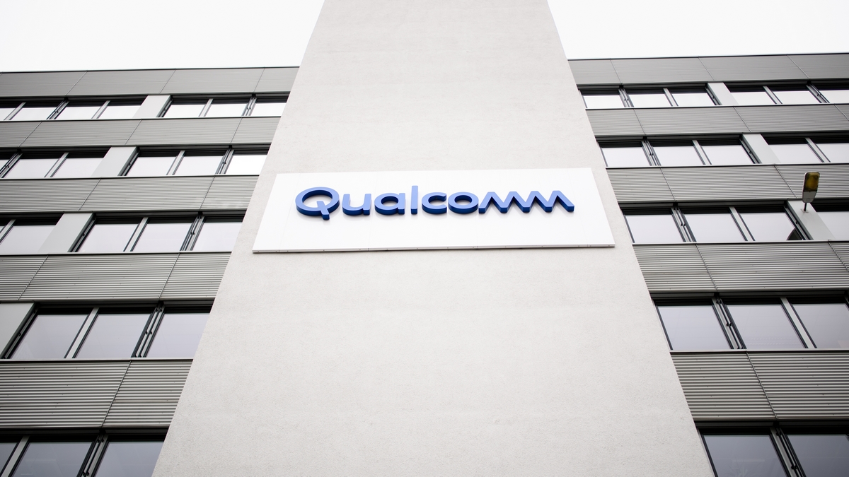 Qualcomm's logo can be seen on a facade of a chip manufacturer's agency.