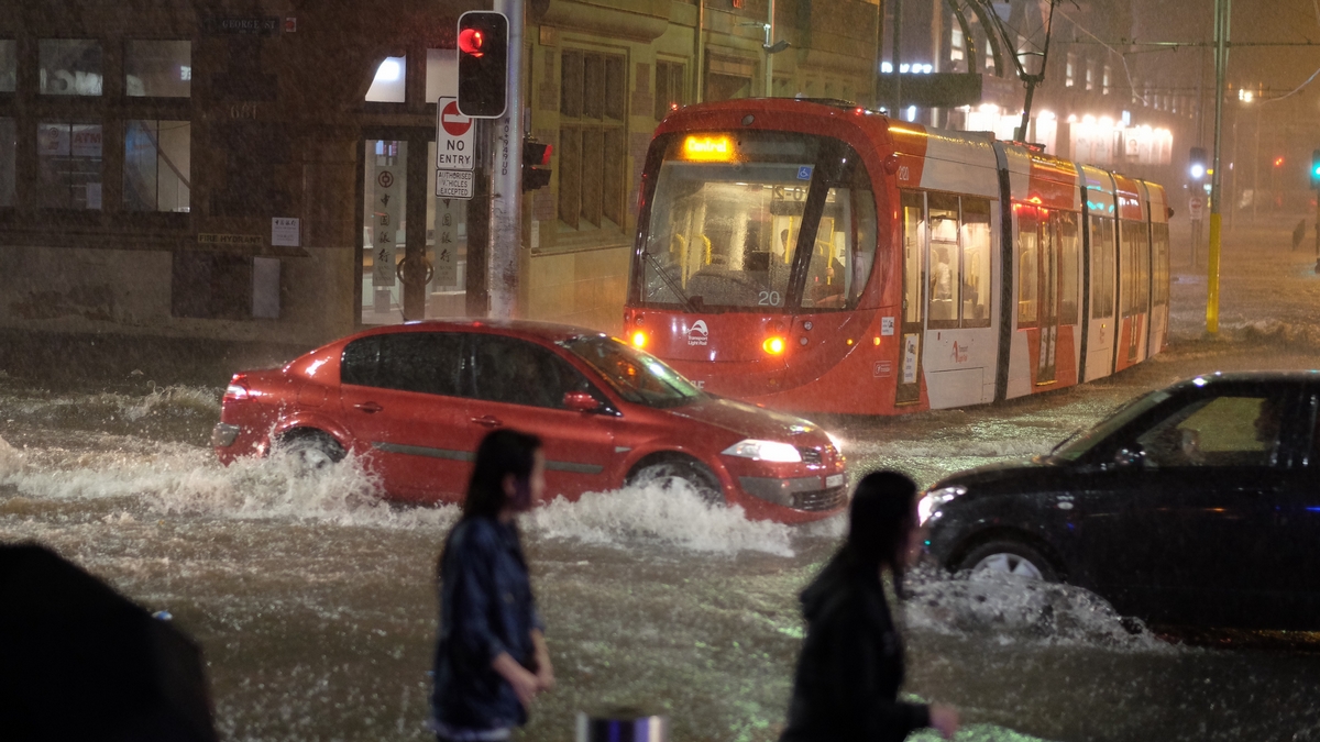 Flooding in Sydney Chinatown with tram