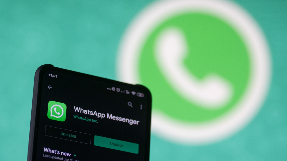 WhatsApp logo displayed on a phone screen, smartphone and keyboard are seen in this multiple exposure illustration. WhatsApp Messenger is a multiplatform mobile application that provides an encrypted instant messaging system belonging to Facebook, photo taken in Amsterdam, Netherlands on January 28, 2020 (Photo illustration by Nicolas Economou/NurPhoto via Getty Images)