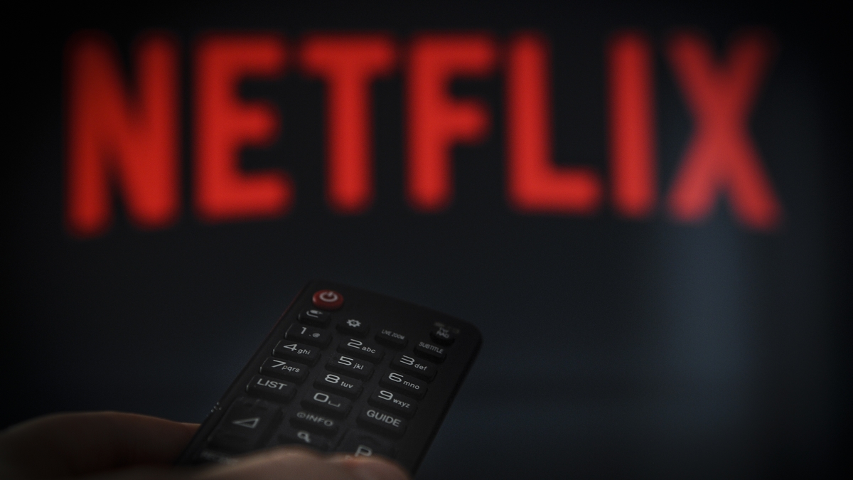 A remote control is seen being held in front of a television running the Netflix application on October 25, 2017. (Photo by Jaap Arriens/NurPhoto via Getty Images)
