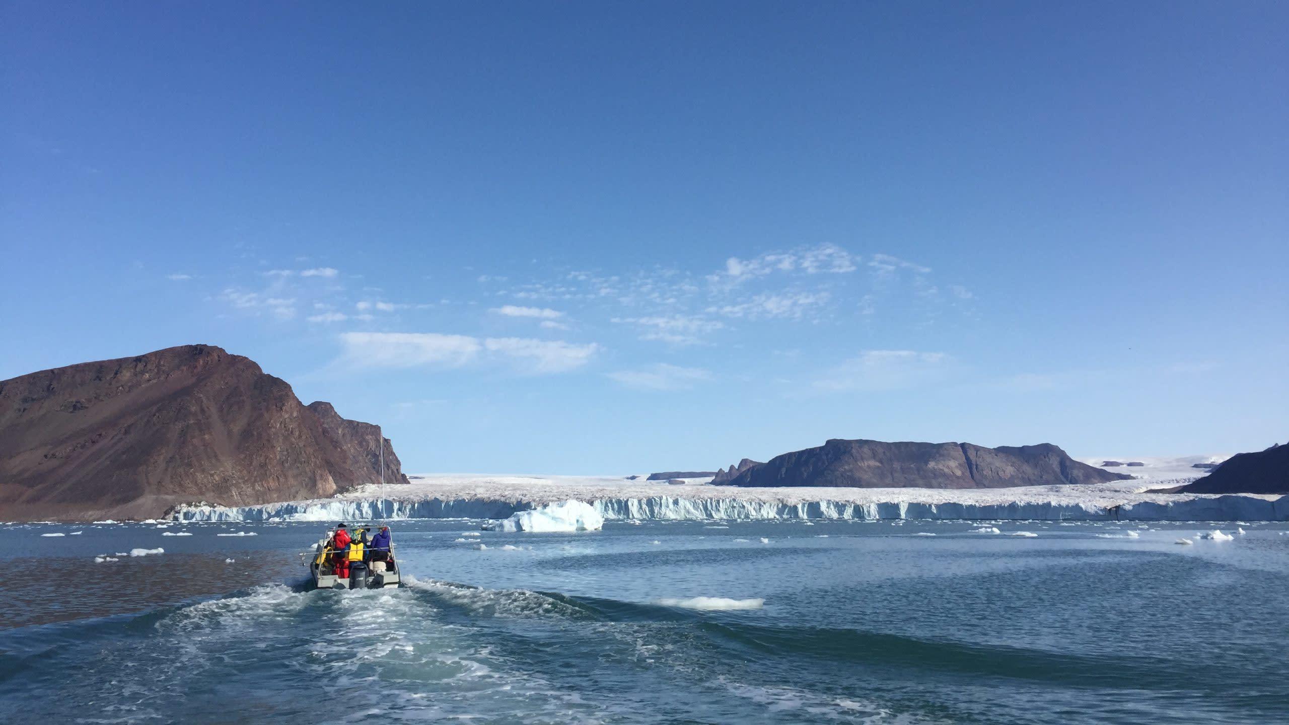 Researchers and Inuit hunters approach Bowdoin Glacier in northwest Greenland. (Image: Evgeny Podolskiy)
