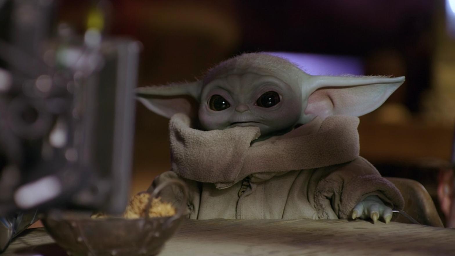 Behind the scenes with Baby Yoda.  (Photo: Disney+)
