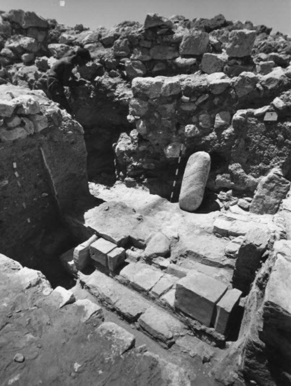 The Tel Arad site during excavations in the 1960s, showing the two toppled altars in their original position.  (Image: E. Arie et al., 2020.)