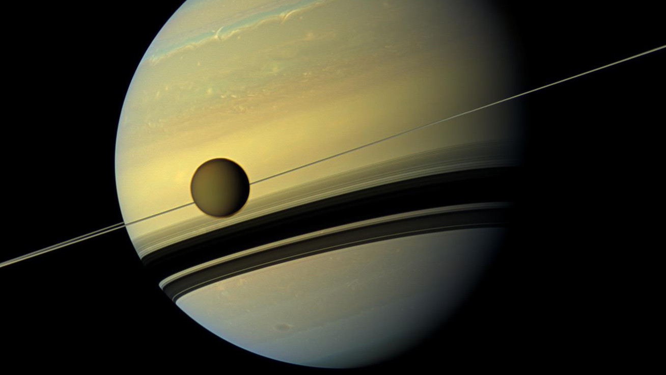 Titan in orbit around Saturn.  (Image: NASA/JPL-Caltech/Space Science Institute)