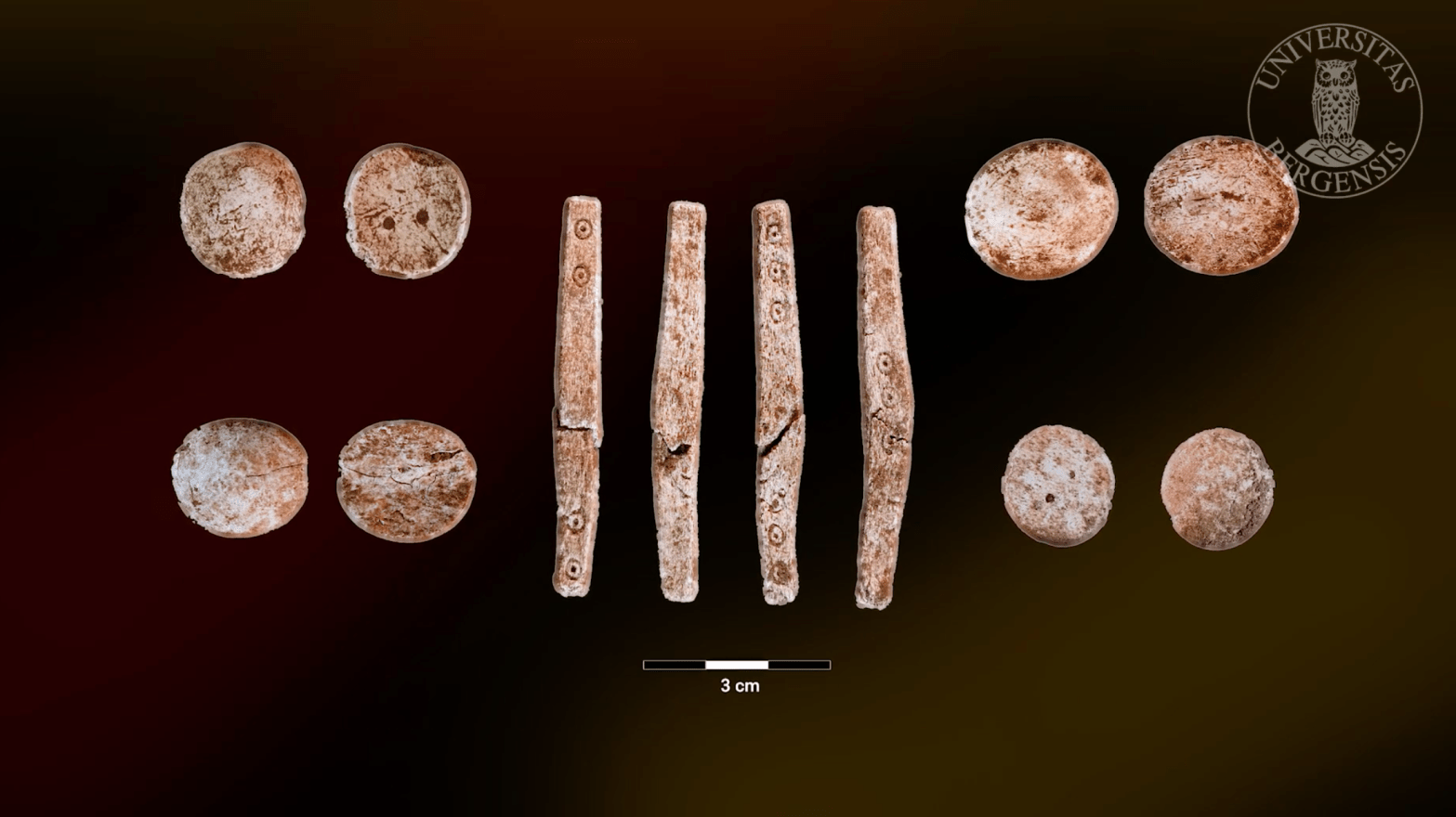 Several game chips (showing both sides of each) and a rare four-sided elongated dice (showing all four sides) found in the cremation pit.  (Image: University of Bergen)