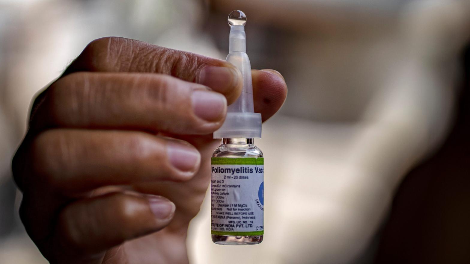 A health worker shows a vial of the oral polio vaccine, used as part of a mass vaccination campaign in the Philippines in 2019. (Photo: Getty Images)