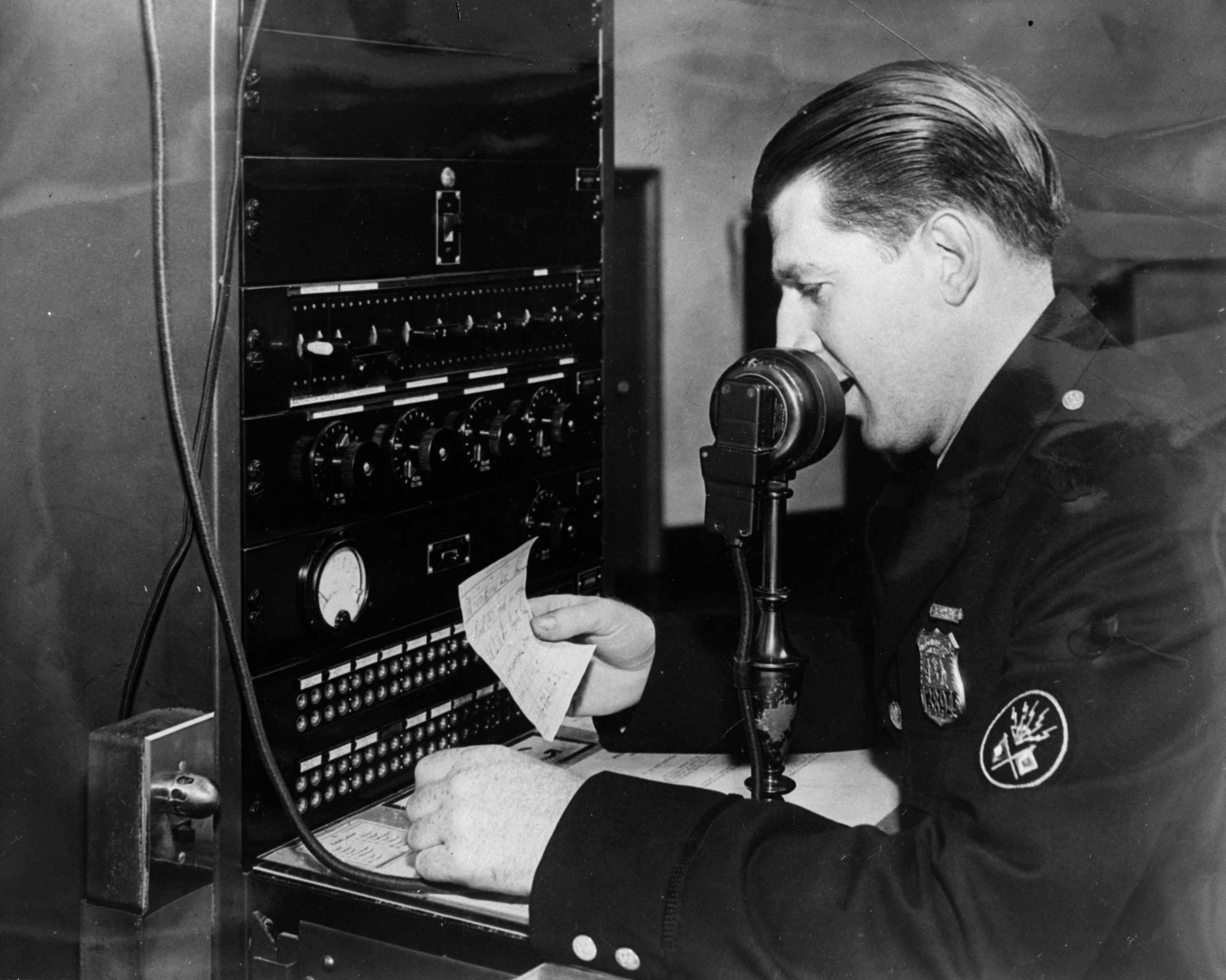 circa 1930: A member of the New York Metropolitan police using a radio-telephone link for communicating with the city's police radio cars. (Photo: General Photographic Agency/Getty Images)
