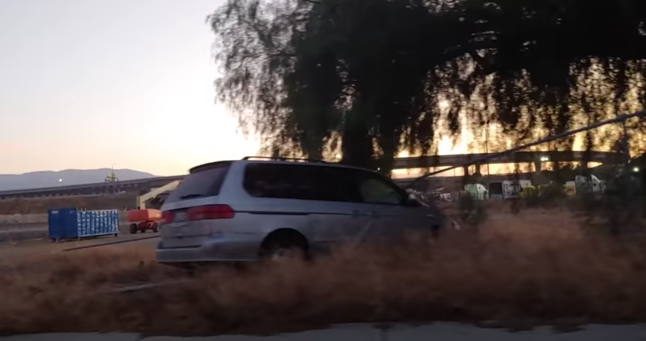 Minivan Driver Flees Hit-And-Run With Motorcycle Still Attached