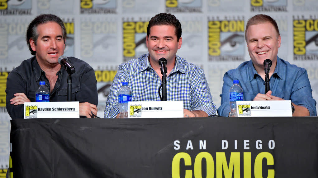 The creators of Cobra Kai, conveniently identified by placards on a 2019 Comic-Con panel. (Photo: Amy Sussman, Getty Images)