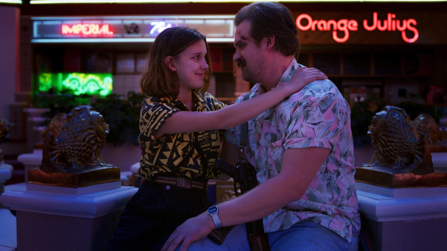 Eleven (Millie Bobby Brown) and Sheriff Hopper (David Harbour) may be on opposite ends of the planet, but they're still family. (Photo: Netflix)
