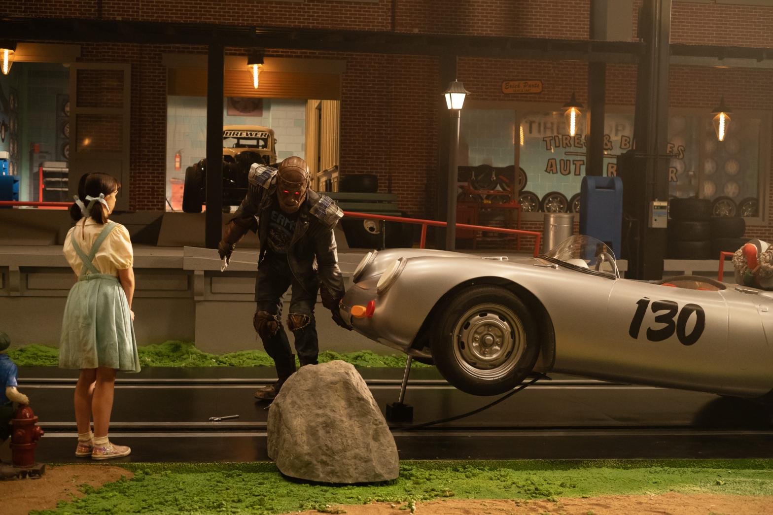 Cliff working on a car while Dorothy watches. (Image: DC Universe)