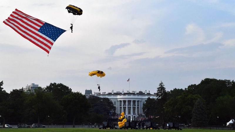 Washington, D.C. on July 4, 2020. Army parachuters carrying a U.S. flag at the White House event on the South Lawn. (Photo: Nicholas Kamm, Getty Images)