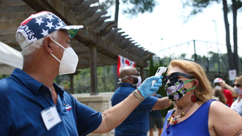 Atlanta, Georgia on July 4, 2020. A woman has her temperature screened before entering the DraftKings All-American Team Cup. (Photo: Carmen Mandato, Getty Images)
