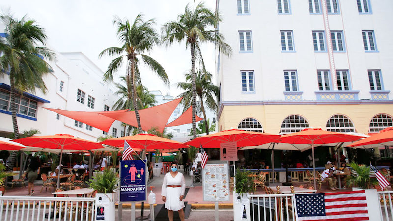 Miami Beach, Florida on July 4, 2020. A hostess waits for customers on Ocean Drive. (Photo: Cliff Hawkins, Getty Images)