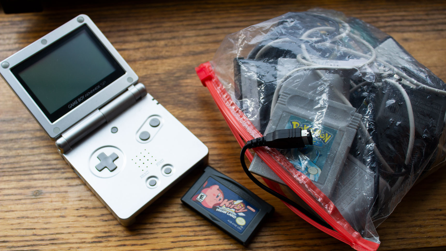 It's not my GBA SP, Nightmare in Dreamland, and stash of cartridges/cords, but it's almost the same as what I carried around back in the day. (Photo: Victoria Song/Gizmodo)