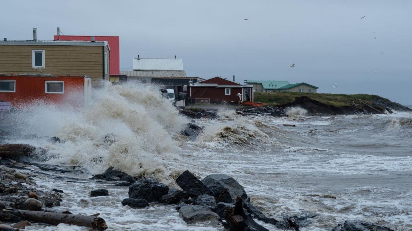 A wave washing up on the Inuvialuit hamlet of Tuktoyaktuk in Canada's Northwest Territories during an August 2019 storm. (Photo: Weronika Murray)