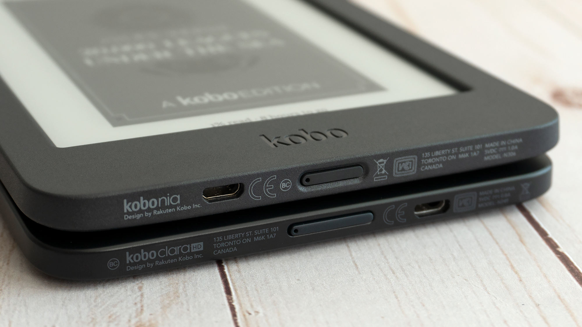 The new Kobo Nia (top) is slightly taller and thicker than the Kobo Clara HD (bottom) but the size differences are negligible. (Photo: Andrew Liszewski (Gizmodo)