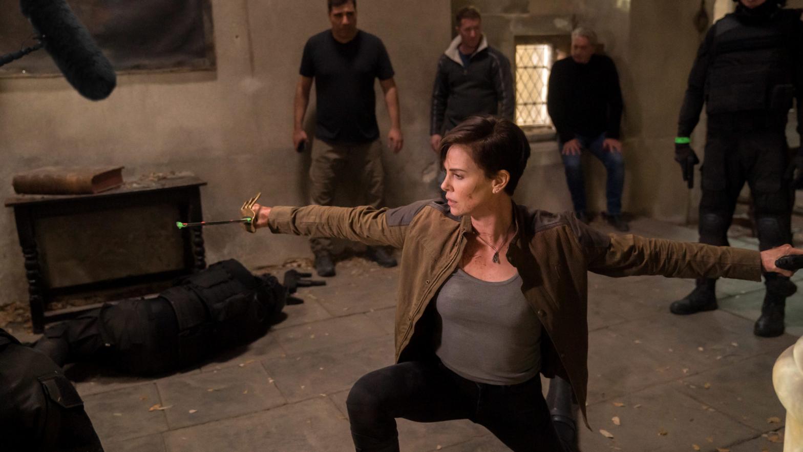 Charlize Theron is directed in a scene from The Old Guard. (Photo: Amy Spinks / Netflix)