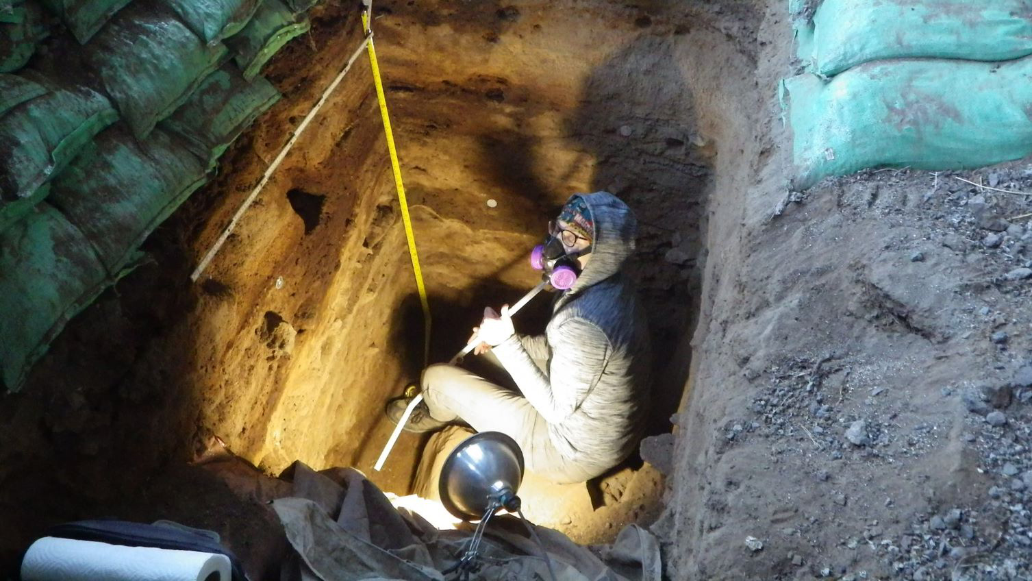 Archaeologist Lisa-Marie Shillito collecting cave samples.  (Image: John Blong)