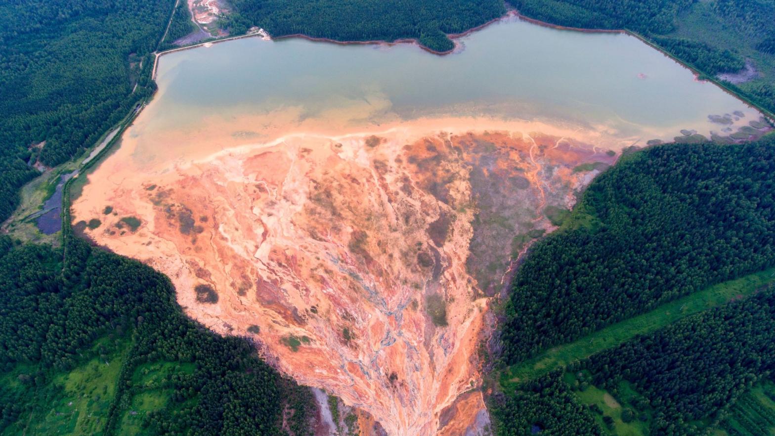 An aerial view taken on June 27, 2020, shows coloured rivers near a disused copper-sulphide mine near the Russian village called Lyovikha in the Urals. (Photo: Sergey Zamkadniy / AFP, Getty Images)