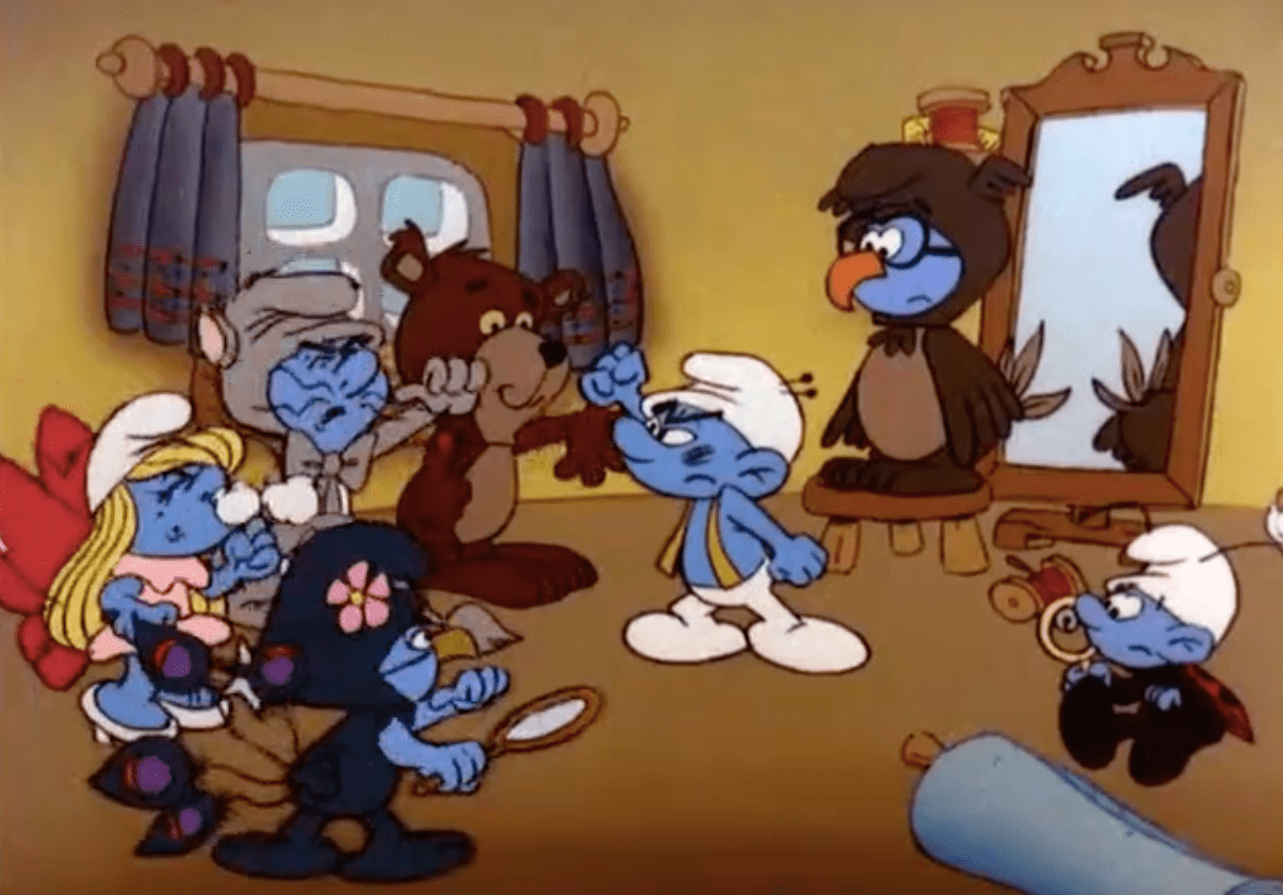 Weirdly, the only costumed Smurf not yelling at Tailor in this scene is Grouchy. (Image: Warner Bros.)