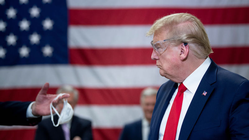 In an interview with Fox News Sunday, President Donald Trump said he would not issue a national mask mandate. (Photo: Brendan Smialowski/AFP, Getty Images)
