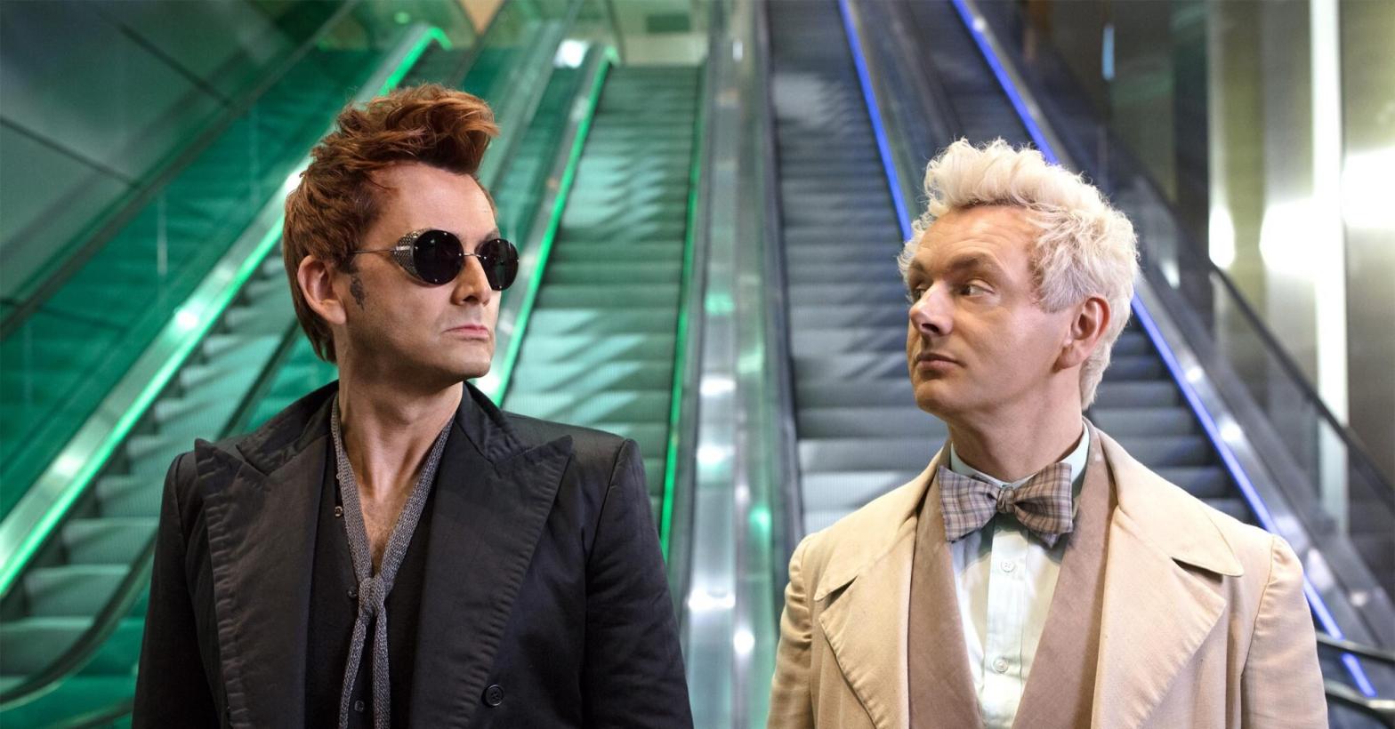 We could all use a little more Crowley (David Tennant) and Aziraphale (Michael Sheen) in our lives. (Image: Amazon Studios)
