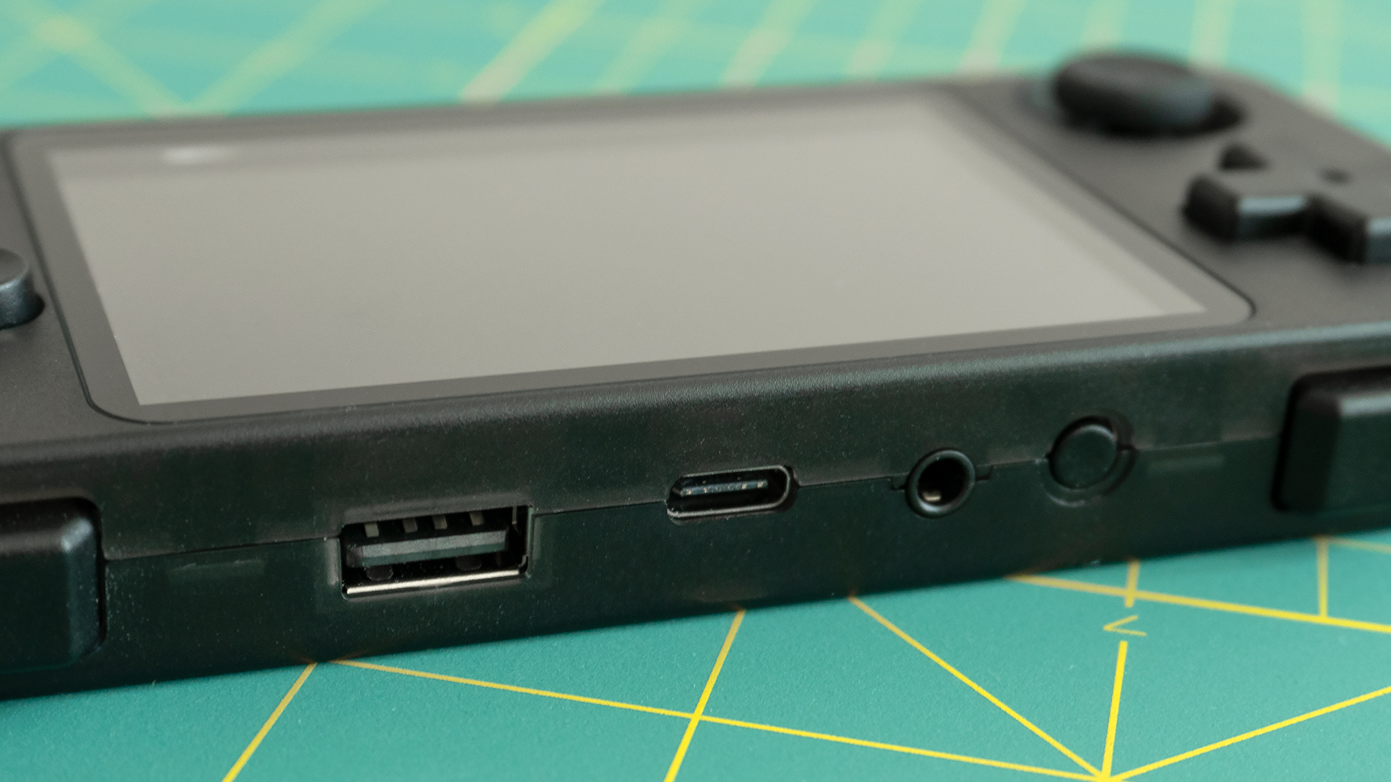 On the top of the RK2020 you'll find a USB-A jack for connecting peripherals, a USB-C jack for charging, and an incorrectly placed headphone jack. (They should always be located on the bottom of devices with a screen.) (Photo: Andrew Liszewski - Gizmodo)