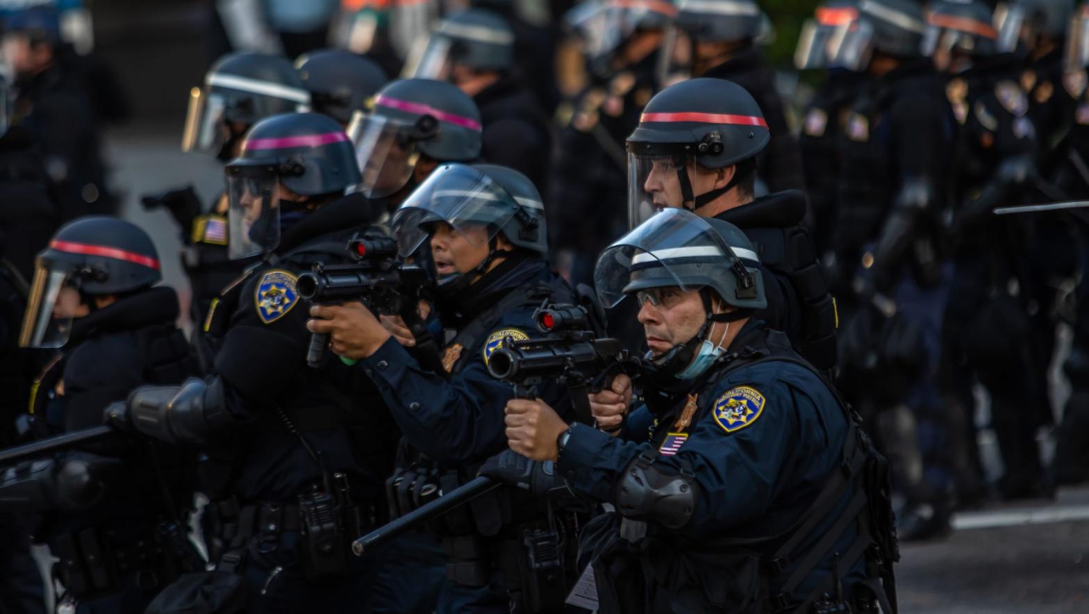 Police officers in Los Angeles wielding weapons during the recent protests against police brutality. (Photo: Apu Gomes/AFP, Getty Images)