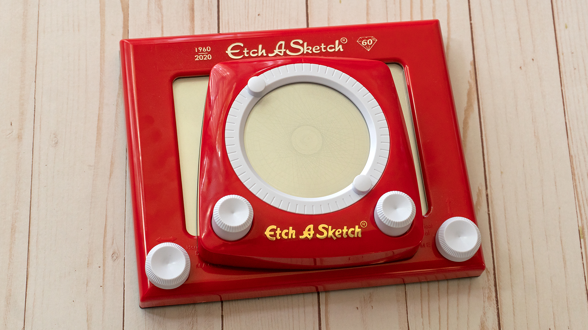 The Etch A Sketch Revolution is quite a bit smaller than the original, but it will also cost you just $US10 ($14). (Photo: Andrew Liszewski/Gizmodo)