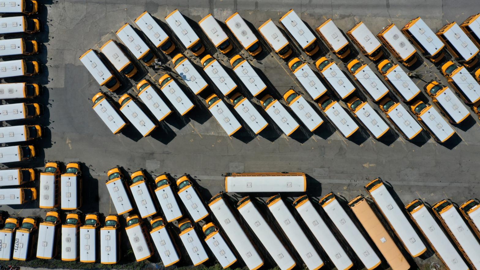 School buses sit parked in a lot at First Student Charter Bus Rental on July 14, 2020 in San Francisco, California. (Photo: Justin Sullivan, Getty Images)