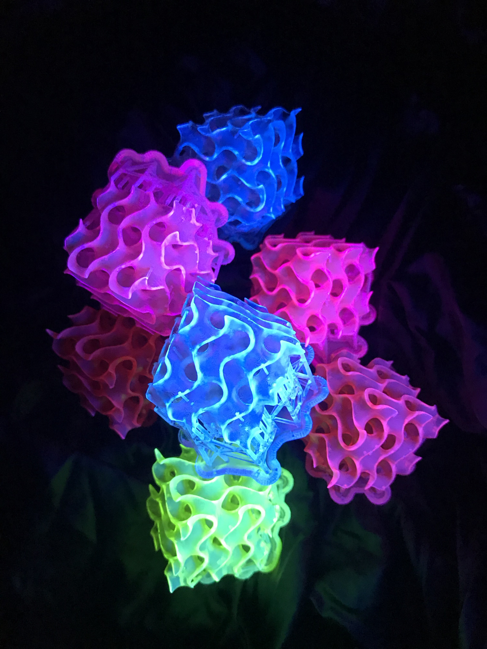 A stack of fluorescent gyroids.  (Image: Amar Flood)
