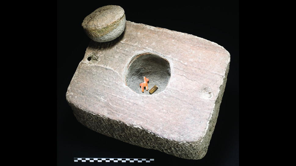 The stone container with llama figurine and gold bracelet inside.  (Image: C. Delaere and J. Capriles, 2020/Antiquity)