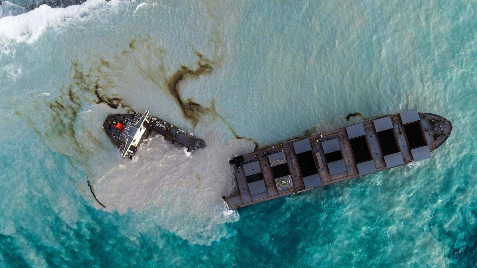 A ship that has leaked more than 1,000 metric tons of oil in pristine waters off the Mauritius coast broke in two on Saturday, and rough seas are making it difficult for salvage teams to respond quickly. (Photo: Stringer, Getty Images)