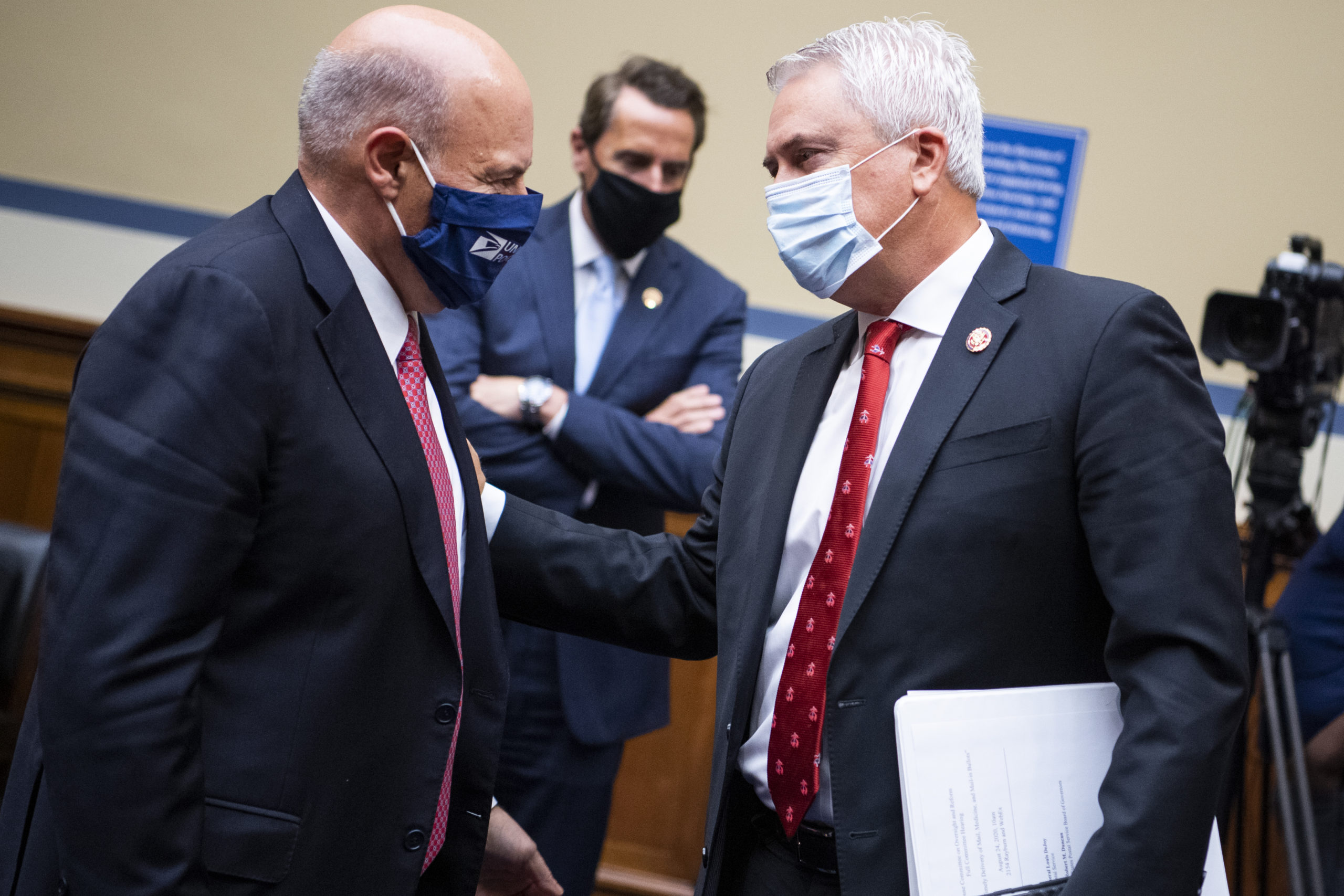 Postmaster General Louis DeJoy exchanges words with Rep. James Comer, the House Oversight Committee's top Republican, during Monday's hearing. (Photo: Pool , Getty Images)