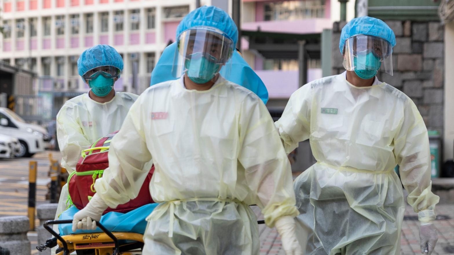 Medical staff wearing personal protective equipment as a precautionary measure against the COVID-19 coronavirus while entering the Lei Muk Shue care home in Hong Kong on August 23, 2020.  (Image: May James, Getty Images)