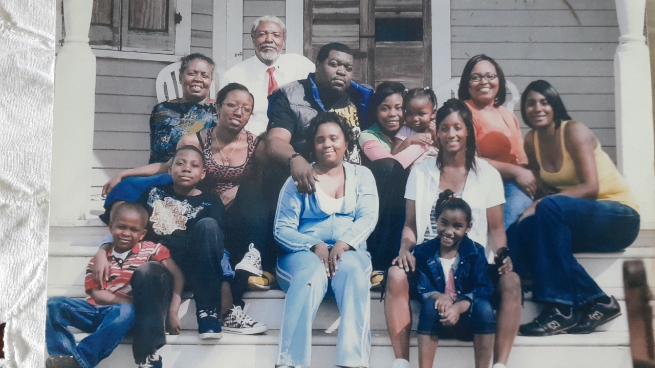 Calvin Alexander is joined on his porch by his wife, children, and most of his grandchildren shortly after Hurricane Katrina hit in 2005. (Photo: Courtesy of Calvin Alexander)