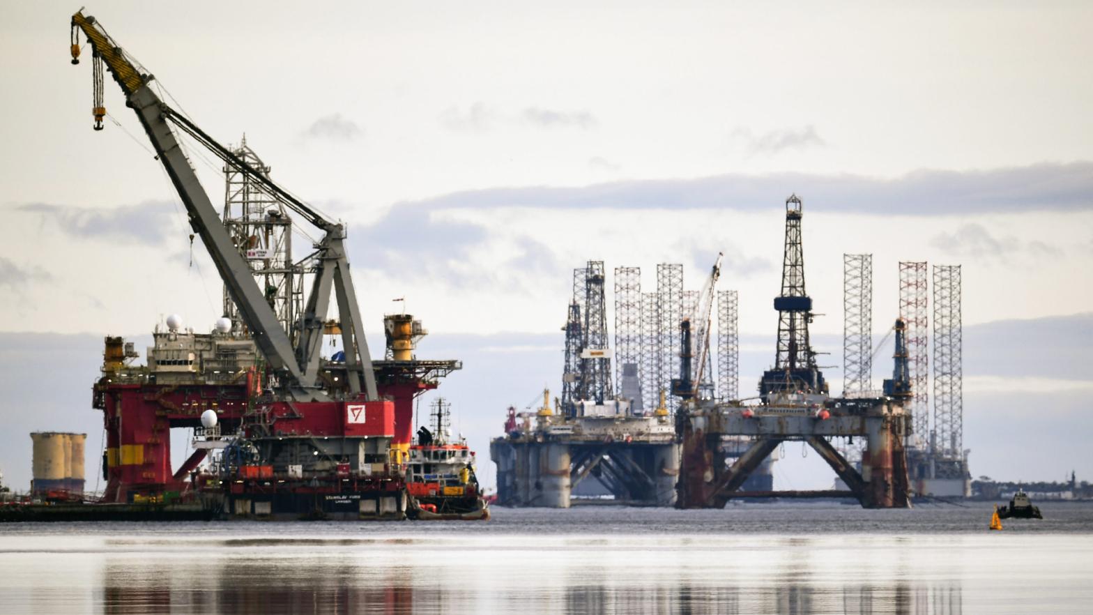 Offshore oil rigs off the coast of Scotland. (Photo: Jeff J. Mitchell, Getty Images)