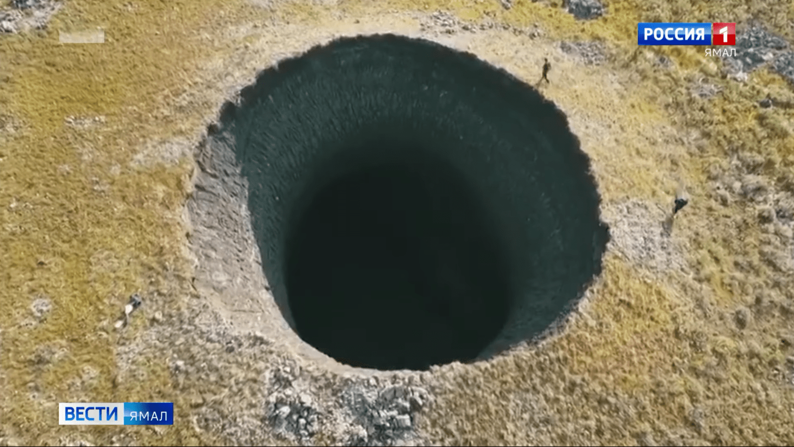 Nothing to see here, just a massive crater in the middle of Siberia after methane probably made it collapse or explode.  (Screenshot: Вести Ямал)
