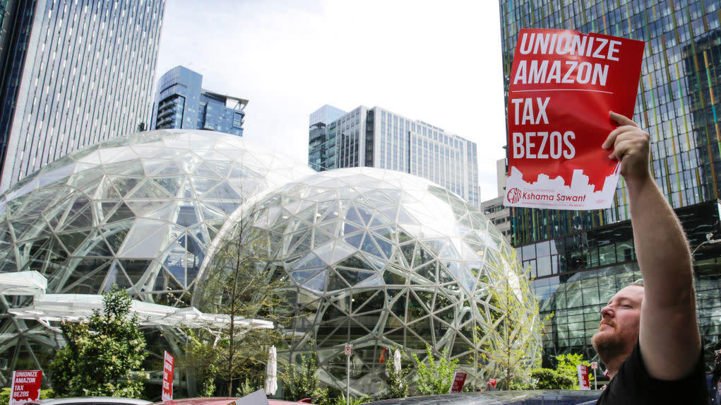 A caravan of protesters in cars surrounds the Amazon Spheres in Seattle, May 1 (Photo: JASON REDMOND / Contributor, Getty Images)
