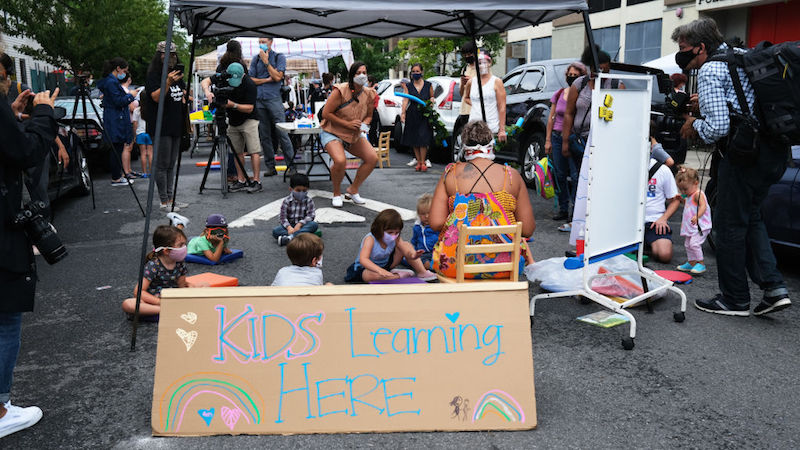 From far away, the outdoor learning demonstration could be mistaken for a street fair. (Photo: Spencer Platt, Getty Images)