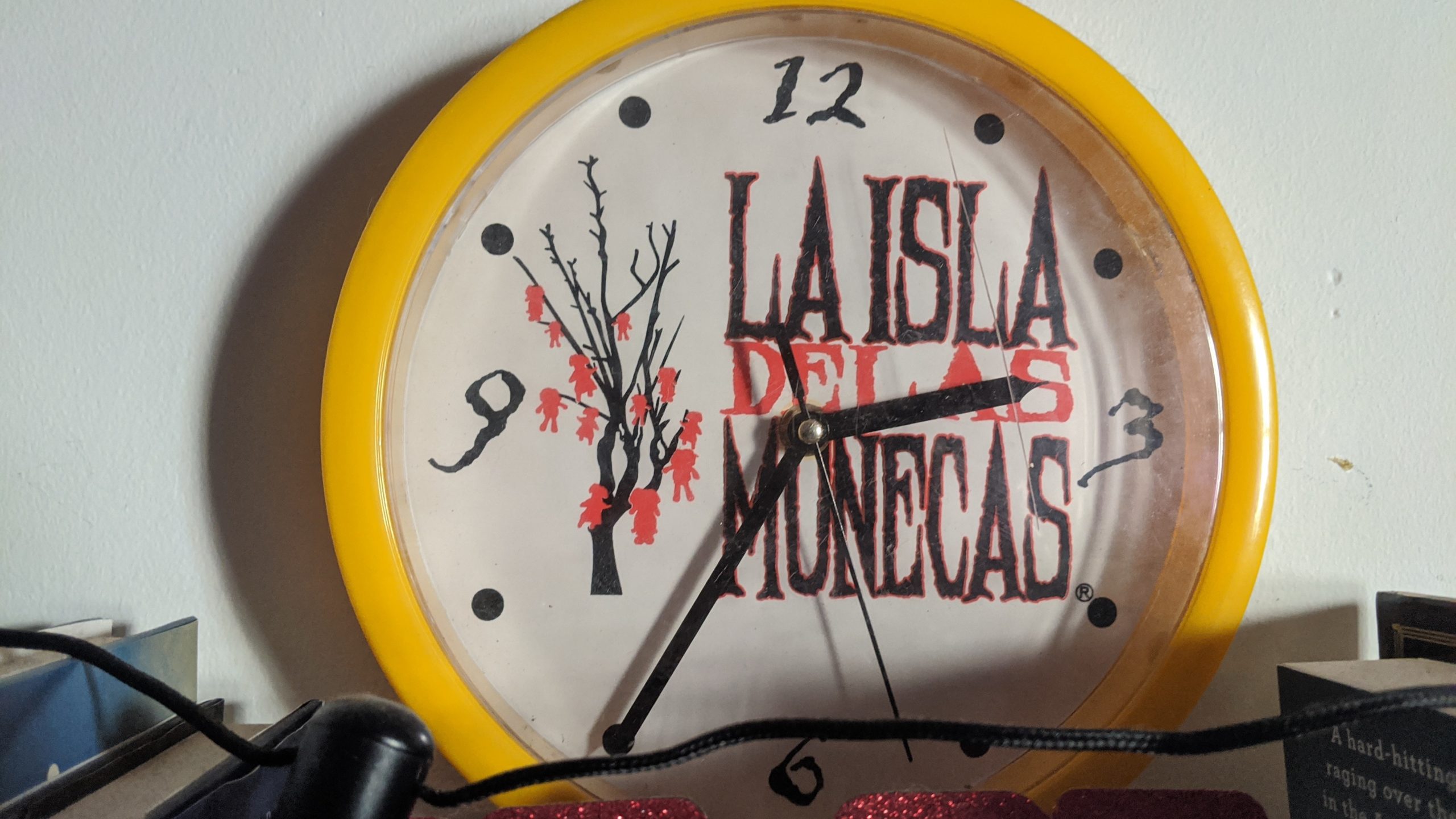 A cursed clock featuring figures hanging from a tree. (Photo: Tom McKay/Gizmodo, In-House Art)
