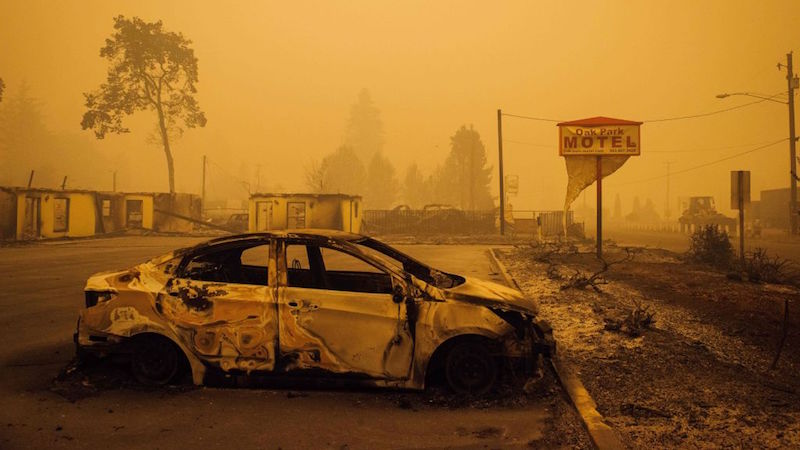 A charred vehicle is seen in the parking lot of the burned Oak Park Motel after the passage of the Santiam Fire in Gates, Oregon on September 10, 2020. (Photo: Kathryn Elsesser / AFP, Getty Images)