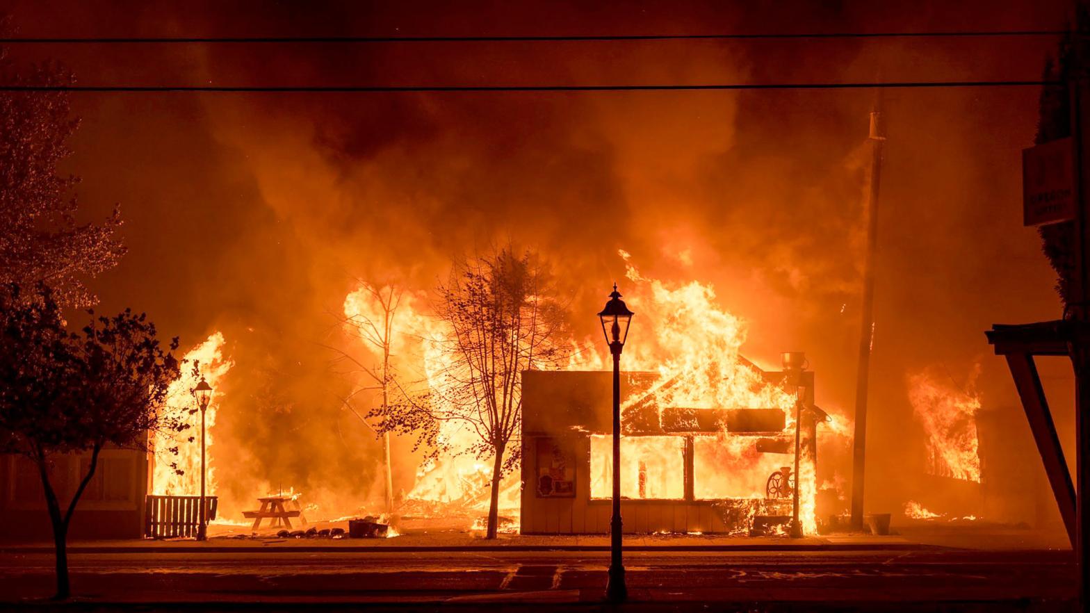 Buildings are engulfed in flames as a wildfire ravages the central Oregon town of Talent near Medford. (Photo: Kevin Jantzer, AP)