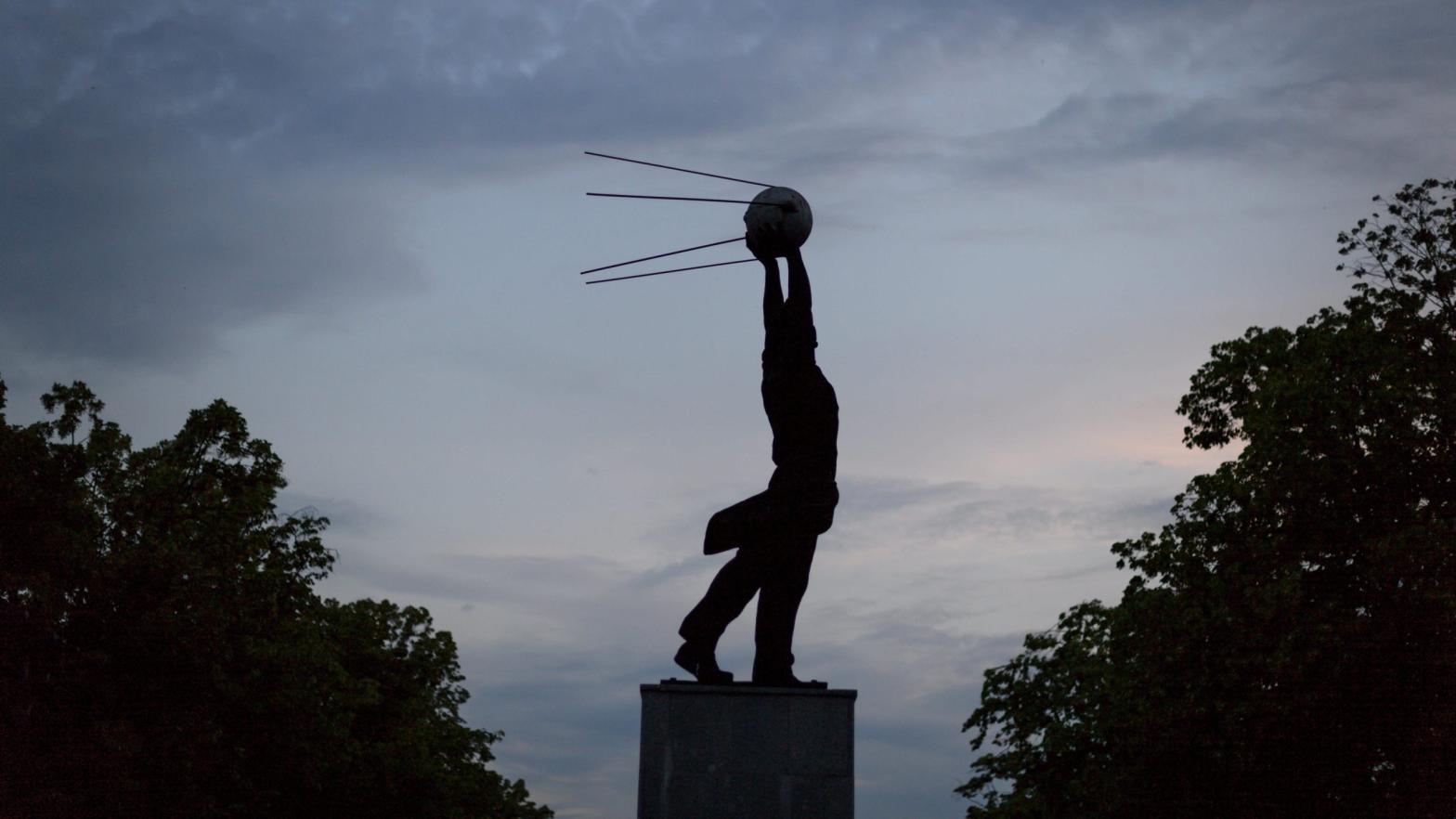 A statue representing a man holding the Sputnik satellite, the namesake of the Sputnik V vaccine, is seen after sunset on June 7, 2018 in Samara, Russia (Photo: Fabrice Coffrini/ AFP, Getty Images)