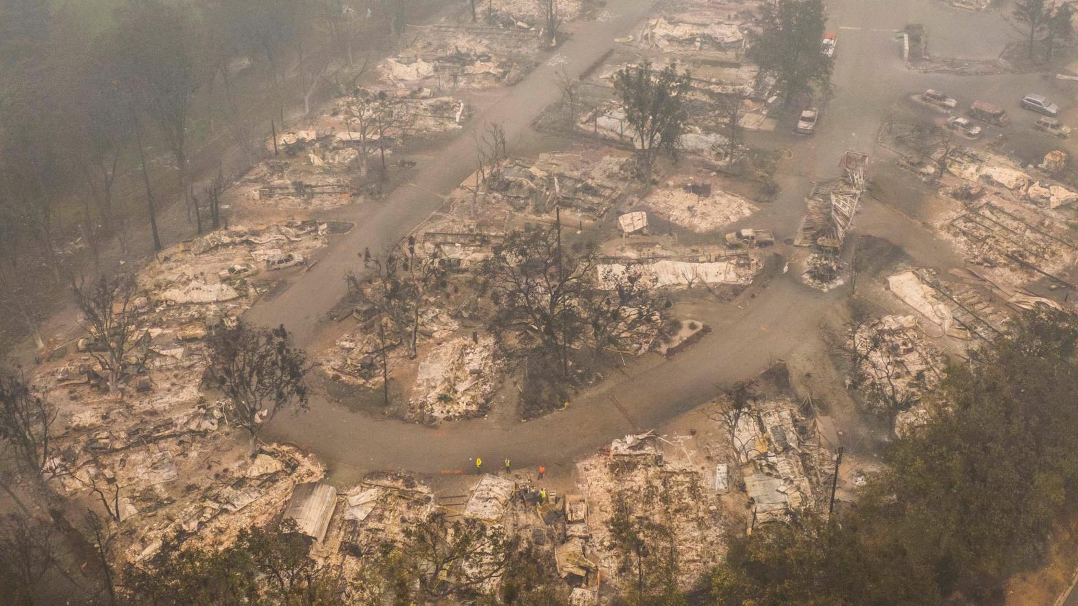 In this aerial view from a drone, damaged homes are seen in a mobile home park on September 11, 2020 in Ashland, Oregon. Hundreds of homes in Ashland and nearby towns have been lost due to wildfires. (Photo: David Ryder, Getty Images)
