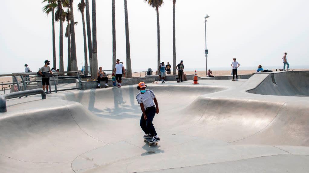 A man wearing a face mask skateboards at a skate park in Venice Beach, California, on September 15, 2020. (Photo: Valerie Macon / AFP, Getty Images)