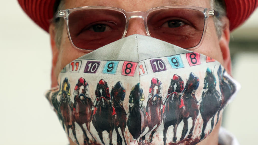 An essential track worker wears a mask ahead of the 146th running of the Kentucky Derby at Churchill Downs on September 04, 2020, in Louisville, Kentucky.  (Photo: Jamie Squire, Getty Images)